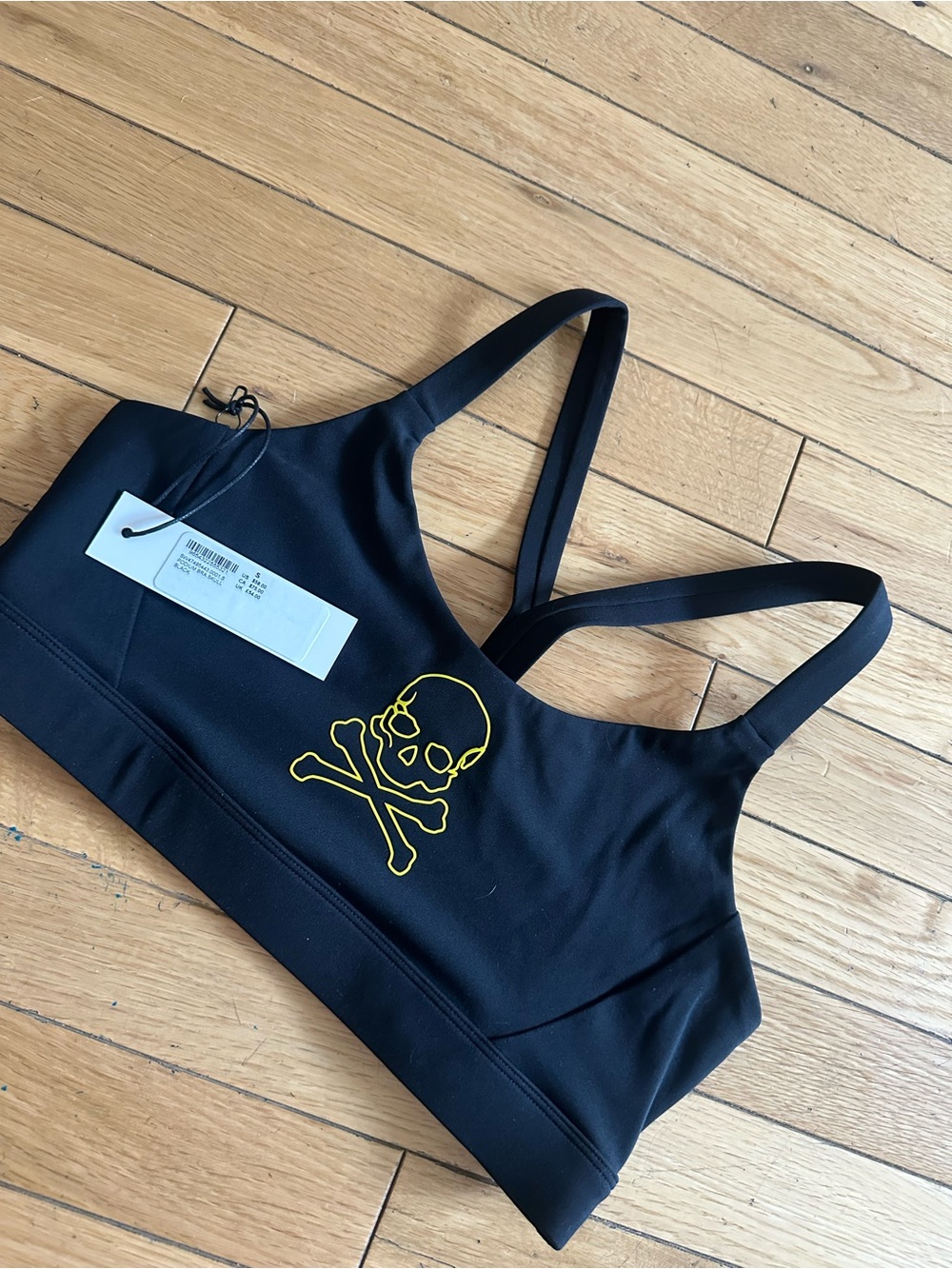 soulcycle Black Sports Bra with Yellow Skull Logo